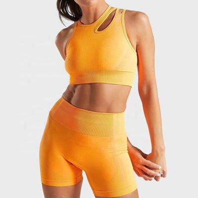 China Newest Antibacterial Women's Gym Yoga Sports Fitness Bra And Shorts Solid Color Yoga Seamless Stretchy Set for sale