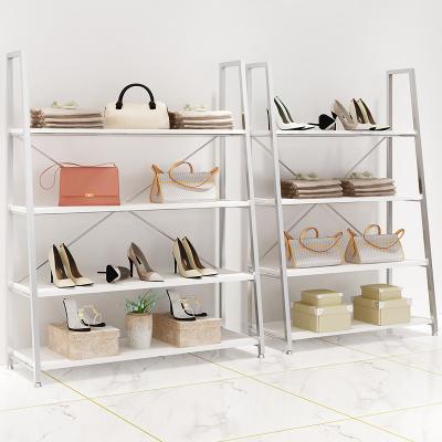 China Xiamen women's and children's clothing store display table shoes bag shelf creative double-sided display rack for sale