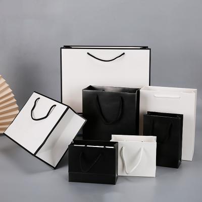 China New Recycled Materials Customize Logo Cotton Rope Handles Hot Foiled Stamping Black Matt Kraft Paper Bag With for sale