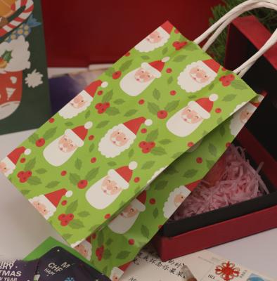 China Materials Manufacturers Recycled Christmas Paper Gift Bag Christmas Wholesale Custom Paper Bag for sale