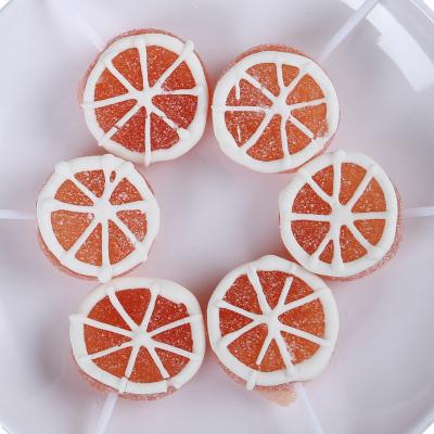 China Yummeet Natural Wholesale Orange Shape Fruity Soft Candy Gummy Lollipop for sale