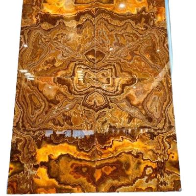 China Luxury Hotel Modern Decoration Wall Panel Honey Onyx Slab Tiger Onyx Backlit Natural Marble Matchbook for sale