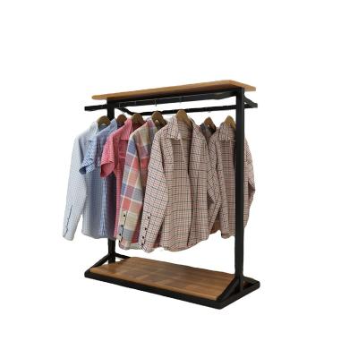 China Recycled Materials Single centre island menswear shop hanging rack display props top bottle wine holder shelf wine rack with glass for sale