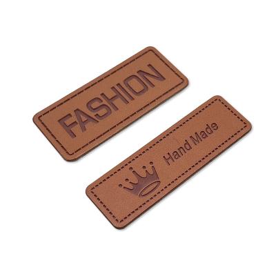 China Other Colored PU Leather Travel Triangle Swing Strap Stet Rivet Purse Pet Paper Panties Neck Embossed Leather Small Name Tags For Bags for sale