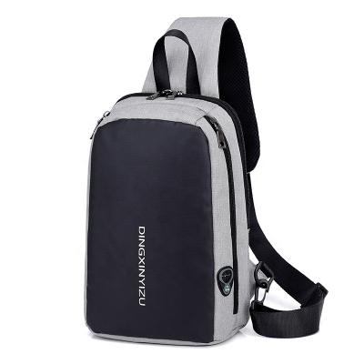 China Sturdy and Durable Fashion Style Travel USB Sling Chest Bag Cross-body Bag Casual Backpack Sports Trunk Filler Bag with Earphone for sale