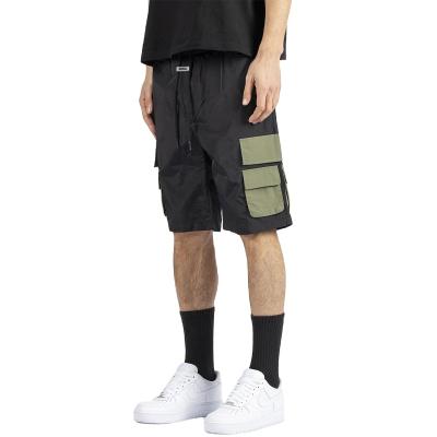 China Breathable Mans Shorts 4 Color 65% Polyester Fiber Under Knee Length Two Color Fit Loose Block Custom Cargo Shorts With Big Pocket for sale