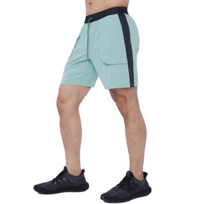 China Summer Breathable Casual Pants Fitness Gym Shorts Loose Five Point Mid Drawstring Bars Wholesale Sports Beach Pants Men for sale