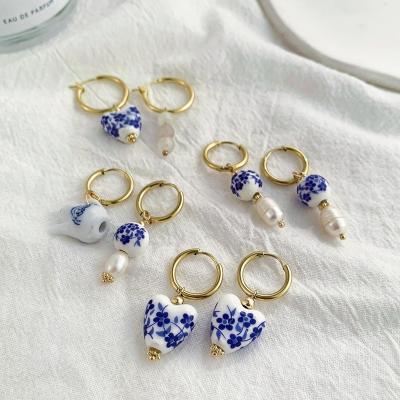 China TRENDY Asymmetric Handmade Round Heart Flower Ceramic and Pearl Hoop Earrings for Women Golden Color Stainless Steel Circle Earrings for sale