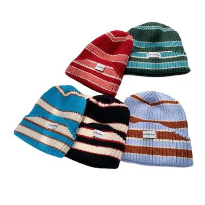 China New Design COMMON Wholesale Winter Beanie Cap High Quality Warm Women Beanie Cap Striped Beanie for sale