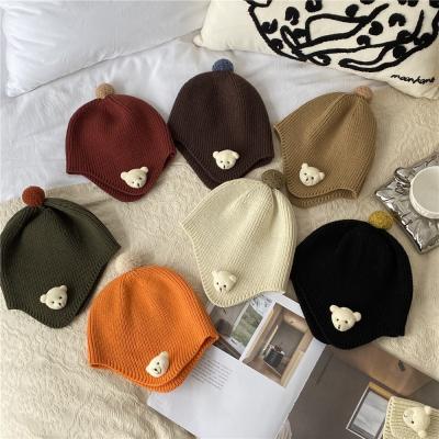 China Winter COMMON Hats Kids Beanie Hat New Arrival Warm Knitted Funny Hat For Girls And Boys Baby With Cute Bear Logo for sale