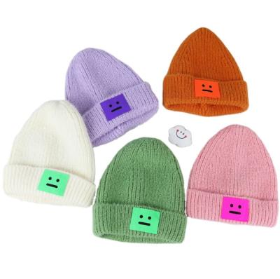 China New COMMON Fashionable Winter Warm Sales Kids Knitted Hat Candy Colors Smile Face Cute Knitted Beanie Cap Hats For Kids for sale