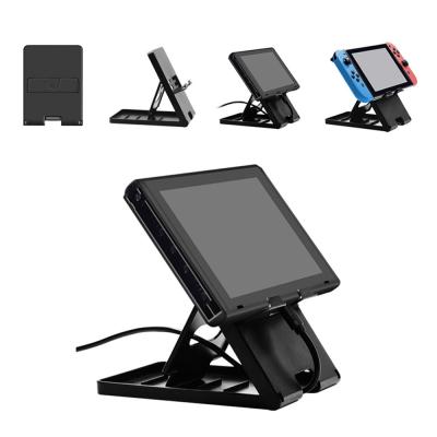 China Newest ABS 2021 Switch Lite Host Bracket Base Universal Game Console Dock For Switch for sale