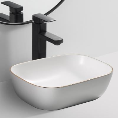 China Modern New Design Ceramic Rectangle Electroplate Countertop Bathroom Basin CE Sink For Home for sale