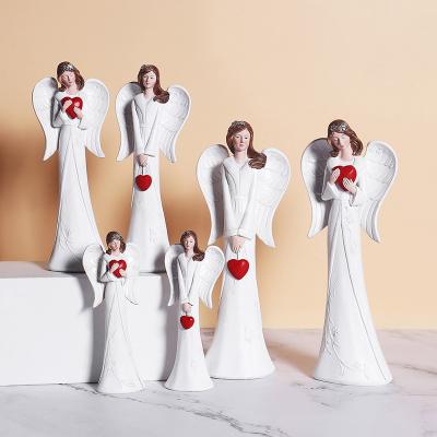 China Europe Holding White Religious Craft Angel Wing Angel Statues Resin Crafts Angel Ornaments Resin Craft Red Love Bundle for sale