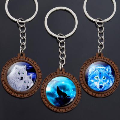 China Vintage Vintage Wolf Key Chains Wolf Howling Wooden Key Chain Wolf Pendant Keyring Moon Glass Cabochon for sale