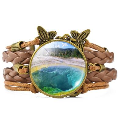 China Fashion New Product November Yellowstone Park View Cabochon Glass Bracelet Handwoven Leather Mens Womens Brown Bracelet Jewelry Gifts for sale