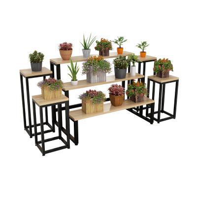 China Creative Modern Simplicity OEM Iron Window Clothing Shoe Hat Display Stand Set Florist Rack for sale