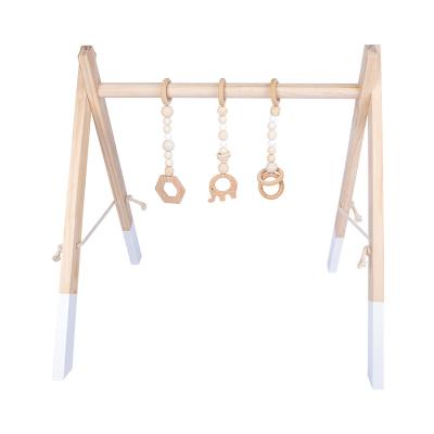 China Non-toxic material Toy Wood Baby Gym without teething wooden baby hanging sight activity gym toy Foldable Baby Play Gym for sale