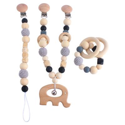 China Toy High Quality Baby Stroller Chain Baby Nipple Chain Three-piece Beech Wood Molars Soft Bracelet for sale