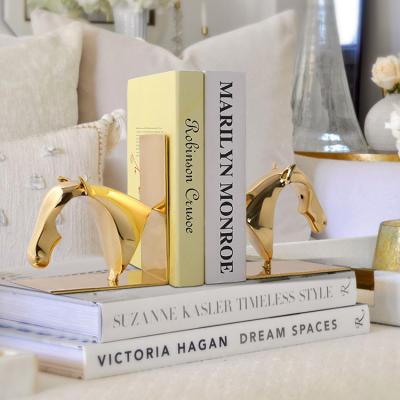 China Simple Modern Creative Light Book Stand Brass Luxury Simple Modern Book Reading Stand Desktop Bookends Desk Ornaments for sale