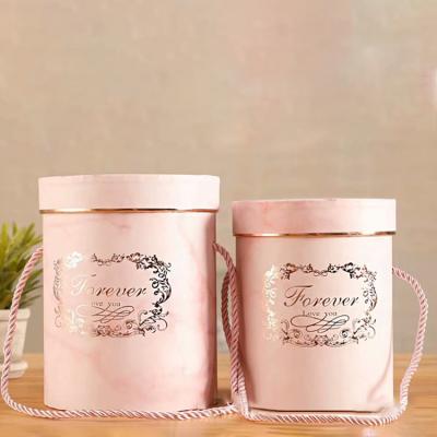 China 2020 Gift Packaging Cylindrical Marble Texture Candy Delicate Packaging Box With Rope Handle Bronzing FOREVER Flower Gift Box for sale