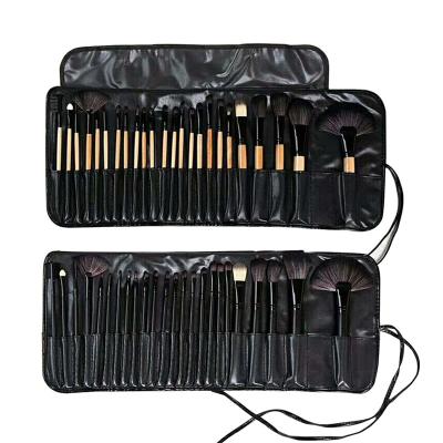 China Angular Blush My Toupee Brush 24 Piece Cosmetic Toupee Brushes With Big Makeup Brush Roll Bag for sale