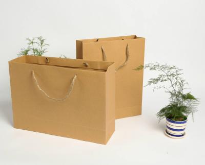 China Large Brown Kraft Paper Chocolate Recyclable Custom Recycled Shopping Paper Bag for sale