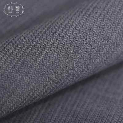 China Small Viable Stain Vertical Stripe Woolen Fabric 293g Men And Women Springs And Autumn Suit Wool Fishbone Worsted Thin Fabric for sale