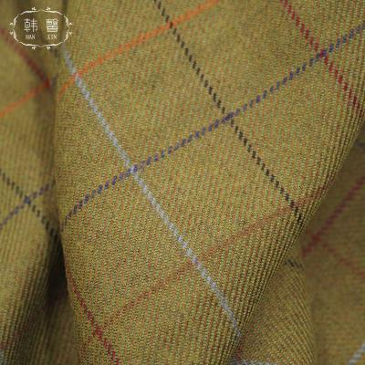 China Yellowish green spring skirt fabric woolen spot twill woolen coat sustainable fabric semi-worsted and autumn coat for sale