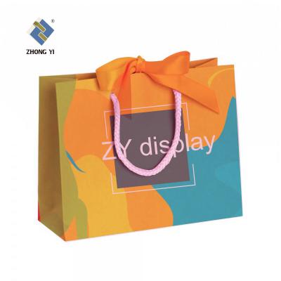 China Recyclable Paper Bag Recyclable Shopping Clothing Package Black Customized Paper Bag With Your Own Logo for sale