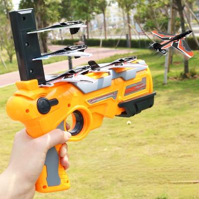 China Outdoor Flying Saucer Glare Launcher Glider Launcher Magic Toy Foam Hand-pushed Airplane Firearm Children Catapult Throwing Toy for sale