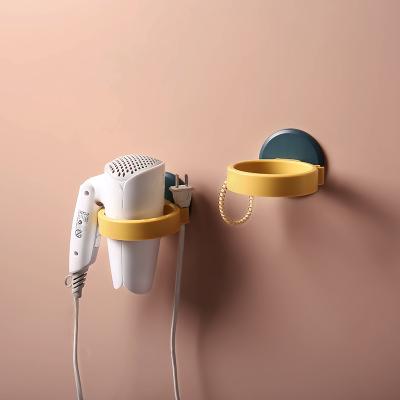 China High Quality Viable Wall Mounted Hairdryer Holder Storage Organizer For Hairdryer Shelf Bathroom Fan Punch Free Holder for sale