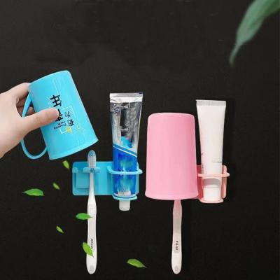 China New Type Viable Wall Mounted Plastic Holder Without Hole Toothbrush And Mouthwash Cup Shelf Bathroom Storage for sale