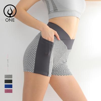 China Breathable V cross honeycomb textured stretchy yoga shorts with shorts crac! crack! Sexy High Pockets Womens Waist Booty Crossover With Pockets for sale