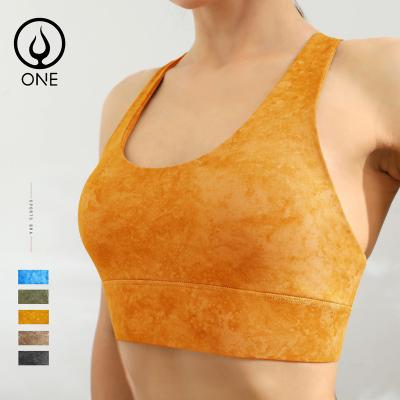 China Breathable Strappy Criss Cross Medium Support High Back Sports Bras With Removable Cups Women Sexy Back Yoga Crop Tops for sale