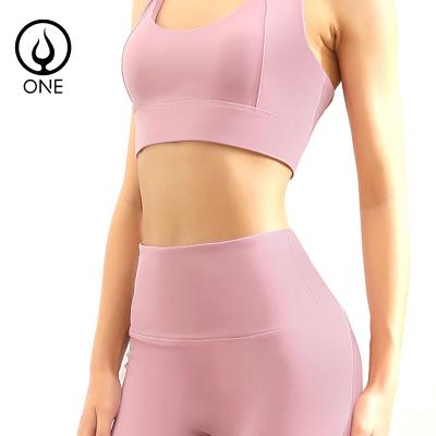 China Breathable Women 2 Piece Yoga Sets Racerback Strappy Padded Sports Bras And Seamless Yoga Leggings With Hidden Pocket In Solid Colors for sale