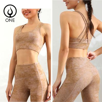 China 2 Piece Breathable Naked Feeling Yoga Sets Strappy Crisscross Back Sports Bras With Removable Pads And Lulu Leggings With Pockets for sale