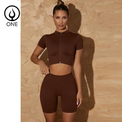 China Breathable 2-Piece Ribbed Seamless Solid Yoga Suits Short Sleeves Double Zippers Gym Fitness Crop Tops And Waist High Butt Lifting Shorts for sale