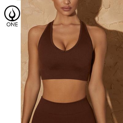 China Breathable 2-Piece Ribbed Yoga Suits Hollow Seamless Solid Back Sleeveless Crop Tank Tops Sexy Racerback Sports Bras And Butt Lift Shorts for sale