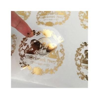 China Clear Waterproof Custom Gold Foil Self Adhesive Private Logo Printing Roll Transparent Labels Sticker for sale