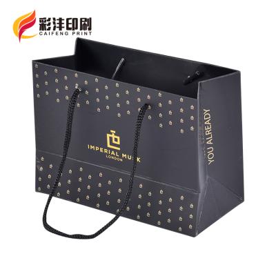 China Handmade Wholesale Custom Printed Black Luxury Shopping Paper Gift Bag With Handle for sale