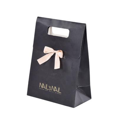 China High End Materials Custom Gold Aluminum Foil Die Cut Handle Black Logo Recycled Hot Paper Gift Bag With Ribbon Bow for sale