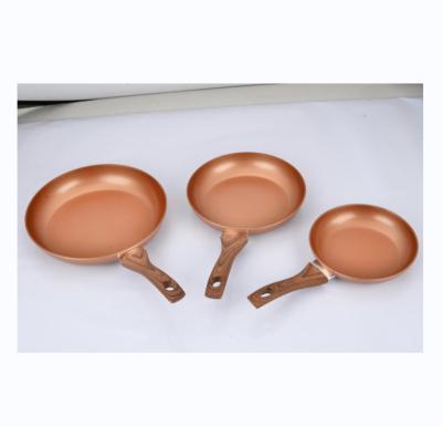 China Durable Ceramic Coating Copper Nonstick Frying Pan Set Cooking Pan Set with Induction Bottom and Soft Touch Wood Handle for sale