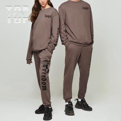 China Breathable Neutral Style Floral Letter Print Loose Minimalist Sweater And Pants Set Drawstring Cotton Sweatsuit Unisex Tracksuit en venta