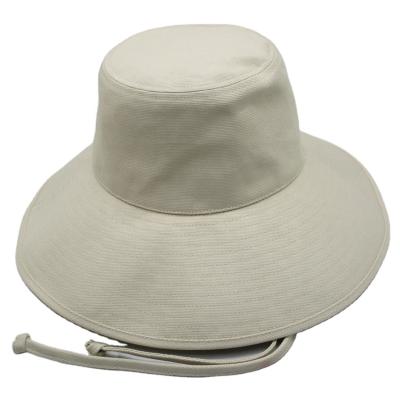 China Striped 100% cotton fabric bucket hat with large brim and chinstrap for sale