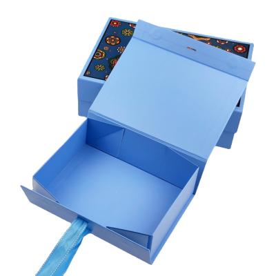 China Recyclable Luxury Foldable Flat Boxes Pink Ribbon Folding Paper Closures Book Shaped Cardboard Flat Gift Box Fold Magnetic Box Blue for sale