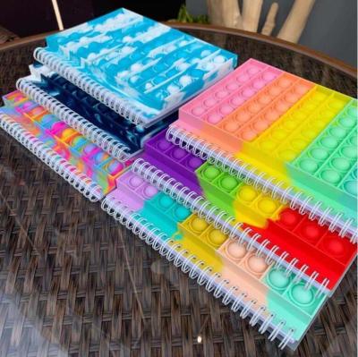 China Various Colors Silicone Bubble Cover Effort Reliver Spiral Notebook Jumping Notebook Journals Antistress Spiral Custom Push Bubble for sale