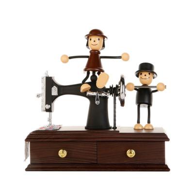 China Send high quality wonderful unique shape puppet doll music and sewing machine music box decoration for kids decoration for sale