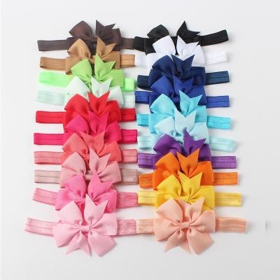 China Wholesale Cheap Hair Decoration Price In Stock Kids Fashion Headwear Hair Accessories New Style Bow Tie Hair Band Elastic Baby Headband for sale