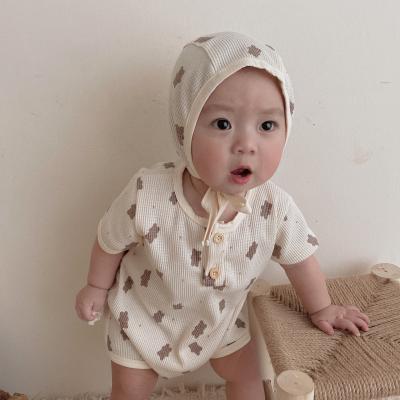 China 100% Cotton Knitted Romper Baby 2022 Summer New Fashion Baby Cute Waffle Overalls Baby Romper Suit Floral Romper for sale